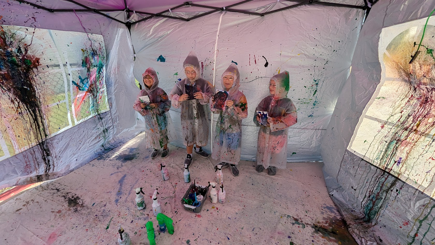 Colorful SIS splatter paint party setup